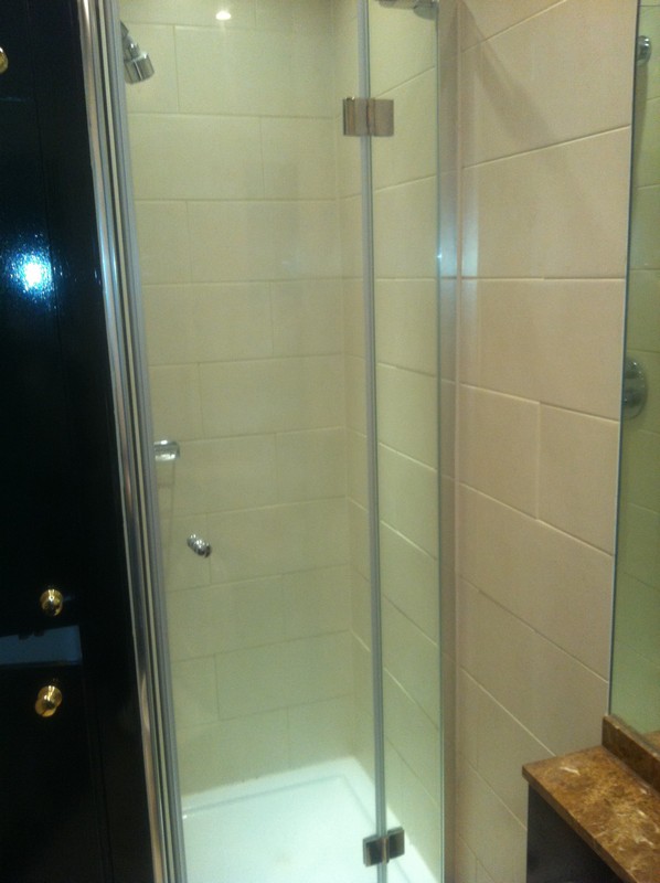 Frameless glass shower enclosure with chrome fittings in Forest Hill